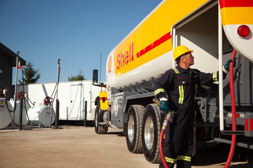 fuel delivery driver on customer site filling tank