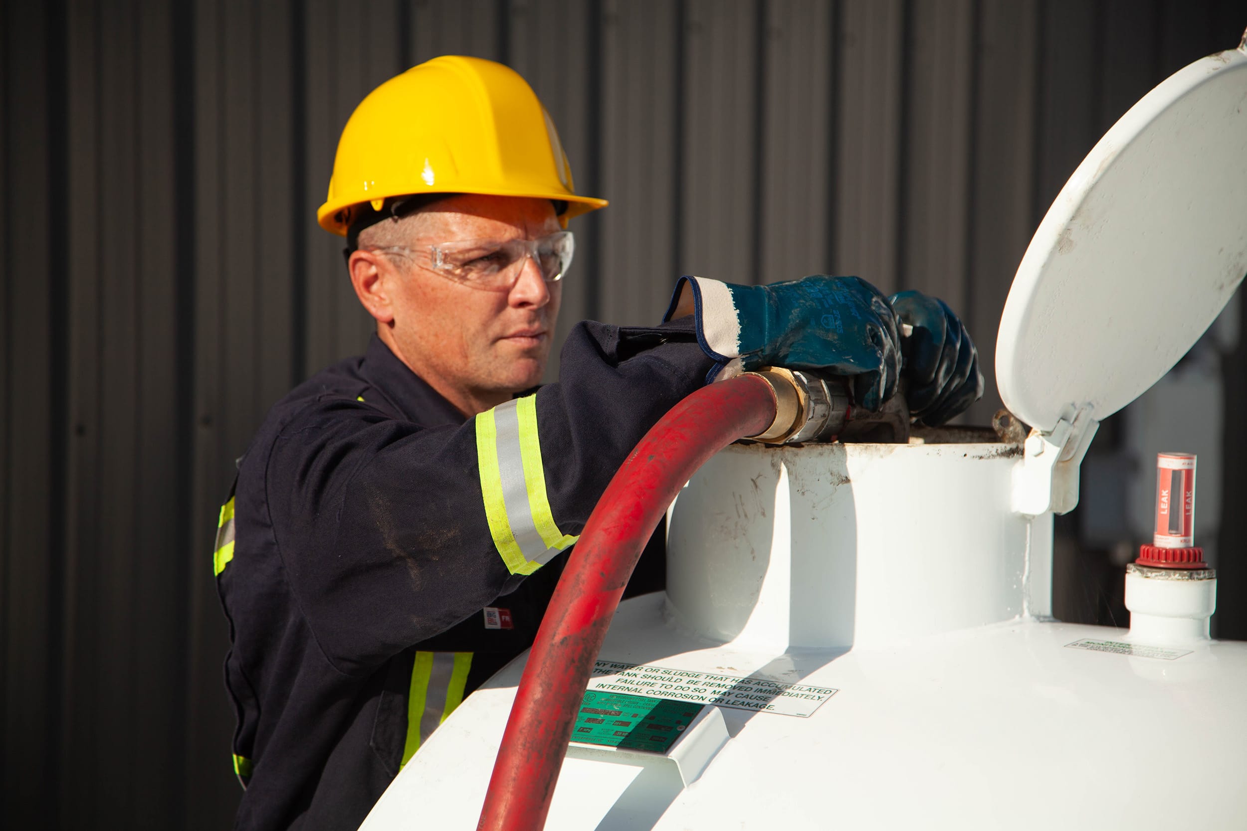 Fuel delivery driving filling a tank